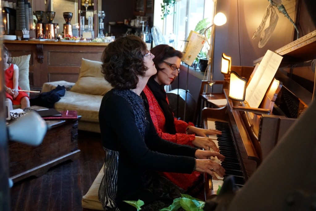 Wendy and Rosie at the piano during a soiree