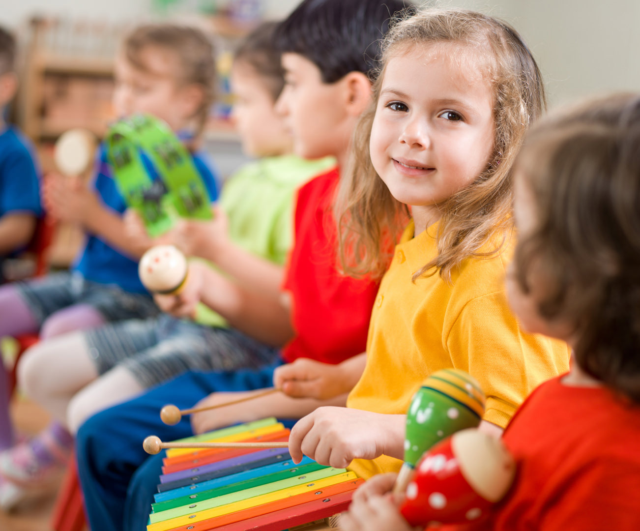 Young girl playing xylophone